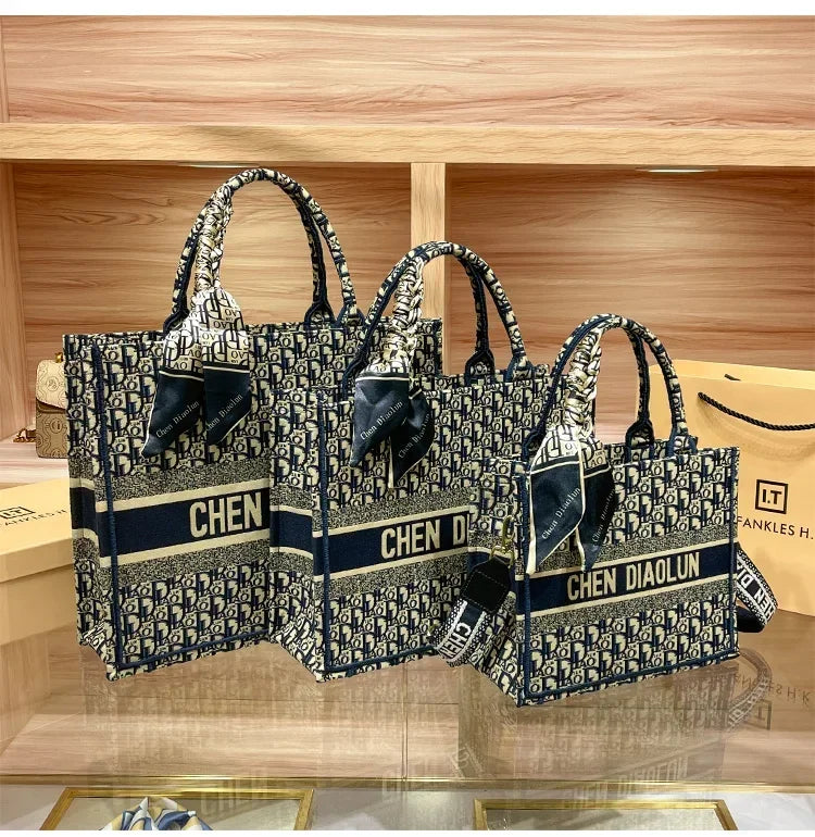 Light luxury leather tote bag, new high-end large-capacity commuting niche single-shoulder handheld women's backpack.