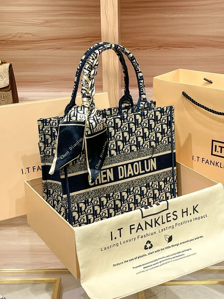 Light luxury leather tote bag, new high-end large-capacity commuting niche single-shoulder handheld women's backpack.