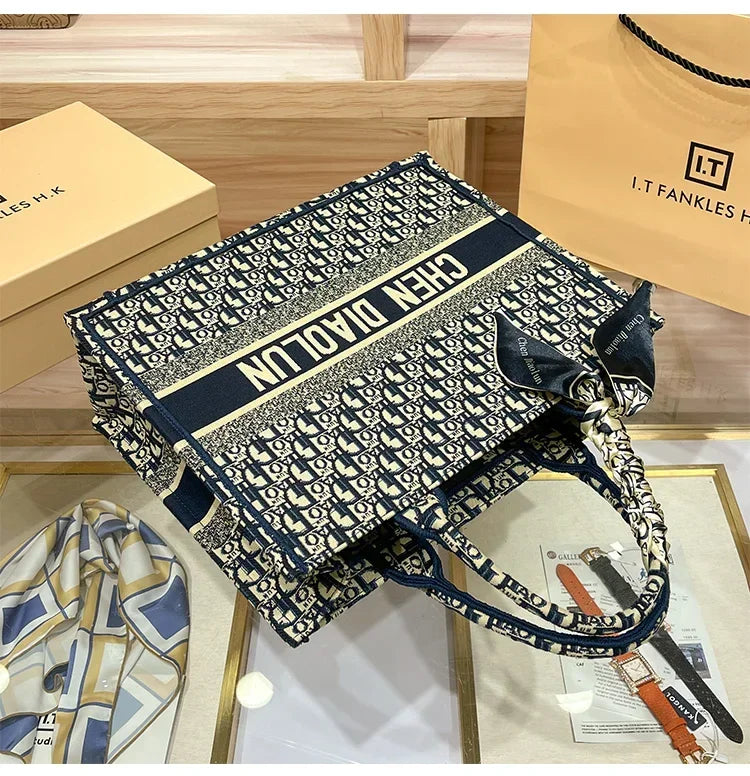 Light luxury leather tote bag, new high-end large-capacity commuting niche single-shoulder handheld women's backpack.