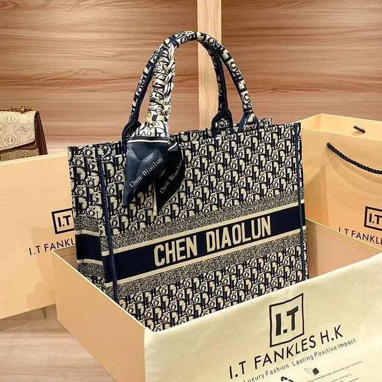 Light luxury leather tote bag, new high-end large-capacity commuting niche single-shoulder handheld women's backpack.