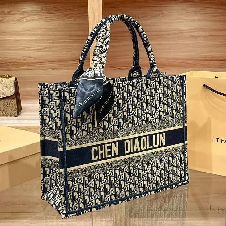 Light luxury leather tote bag, new high-end large-capacity commuting niche single-shoulder handheld women's backpack.